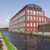 Nicely renovated warehouse just south of the bridge, which is visible beyond by John Howarth – 27 July 2009