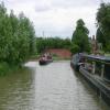 Winding Hole is to the left of the oncoming boat by David Tunbridge – 26 June 2007