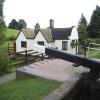 Another of the attractive barrel roofed cottages typical of the Stratford canal. by Jeff Jenkins – 14 August 2005