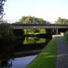 A big curved pond heading up to lock 49 under three bridges by opener – 22 August 2011