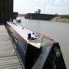 Low tide in the basin, only just enough water for us to moor to the floating pontoon. by Charles Lyne – 17 July 2005